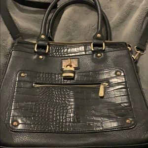 A black purse with gold details